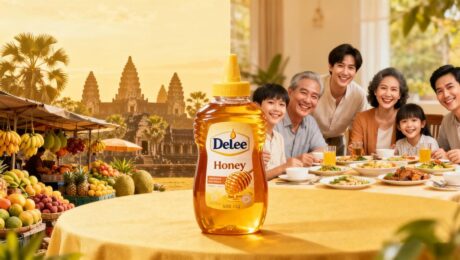 شحنة عسل ديلي فودز إلى كمبوديا مع جرة ذهبية سعة 1 كجم وخلفية أنغكور وات