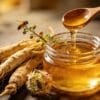 A close-up image showing the rich texture of golden Ginseng Honey dripping into a jar, symbolizing the purity and premium quality of the functional food.